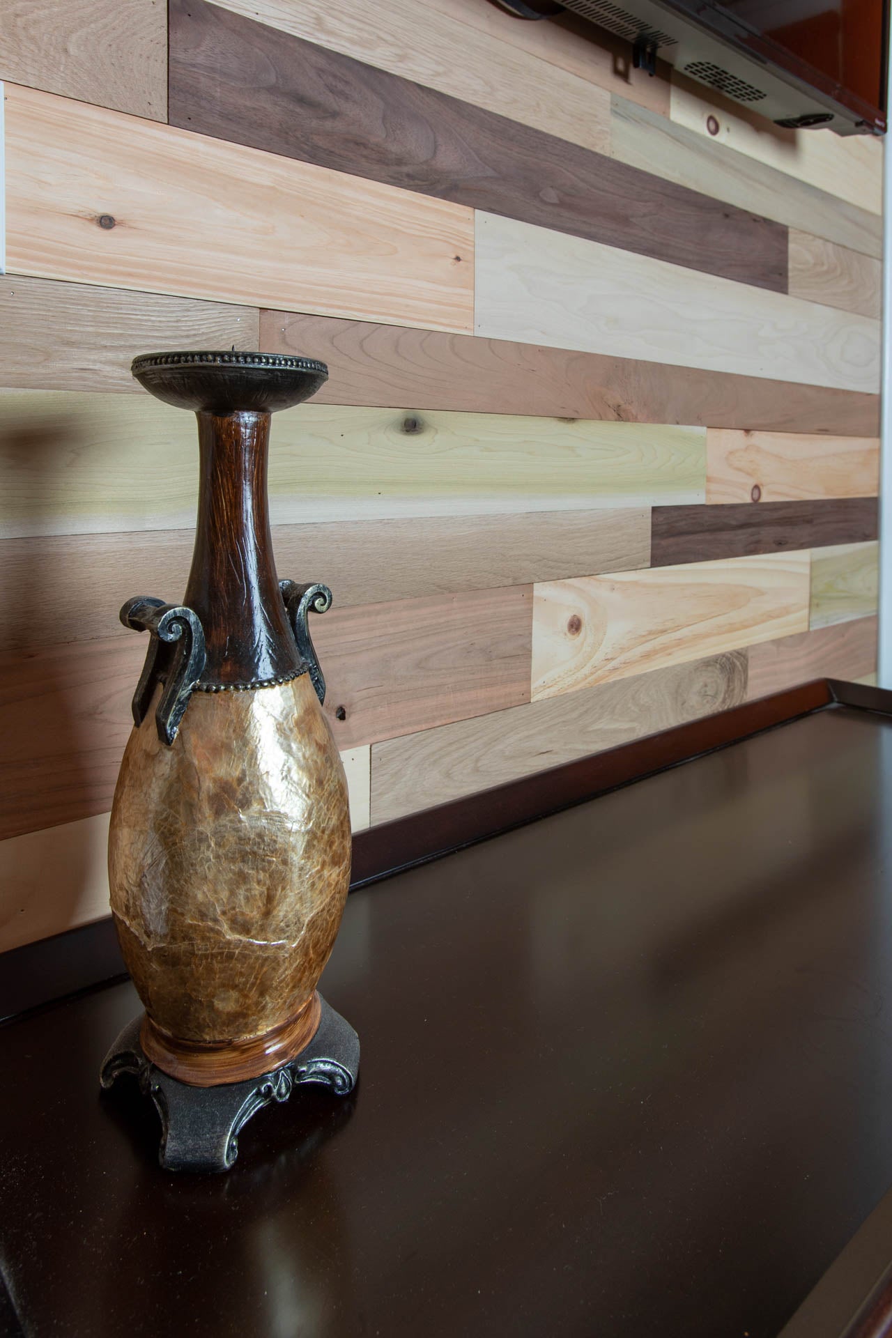 Vintage multicolored reclaimed wooden plank wall.