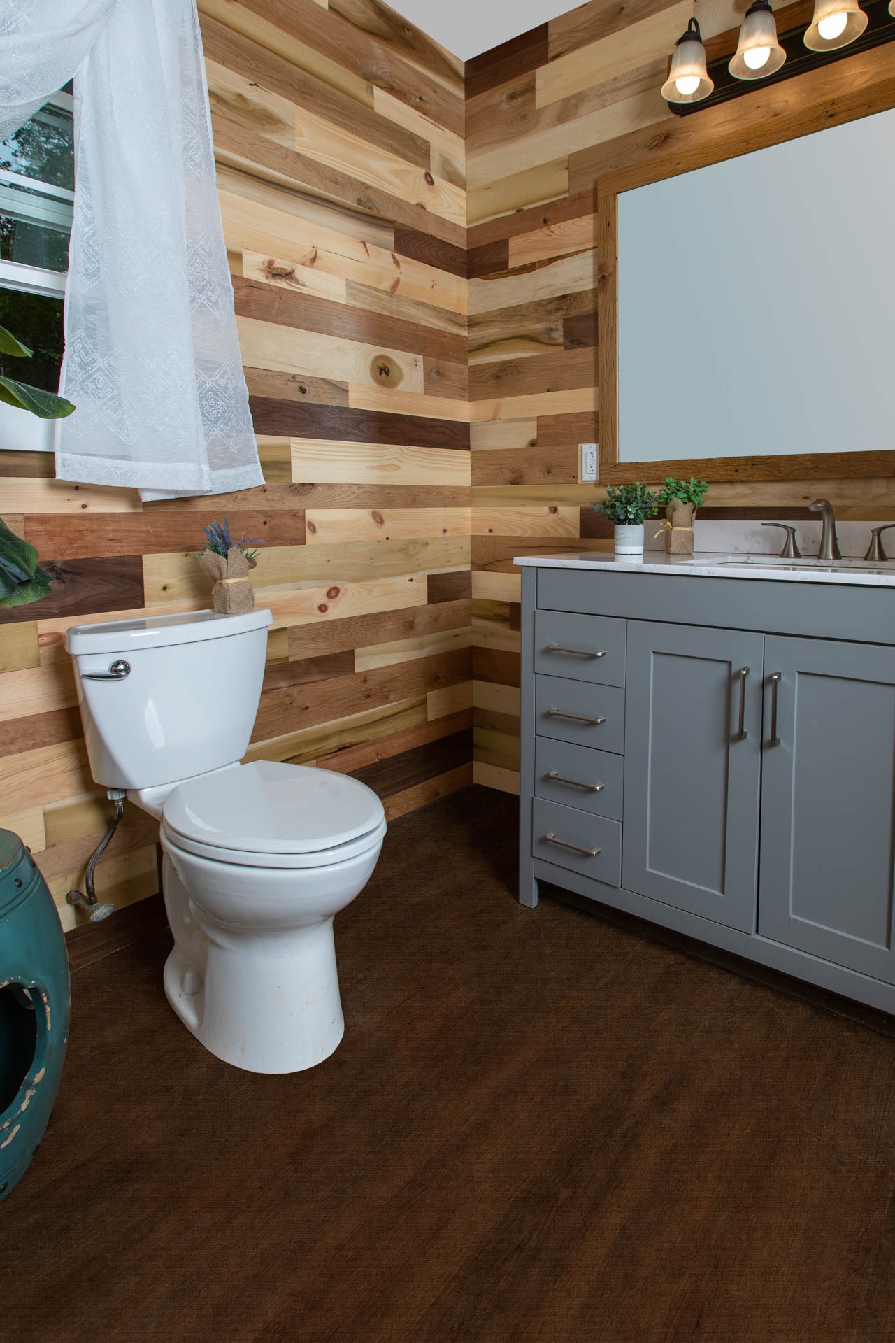 Vintage multicolored reclaimed wooden plank walls in a nice bathroom.
