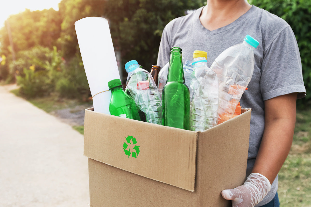 Recycling glass and plastic to live a more sustainable lifestyle.